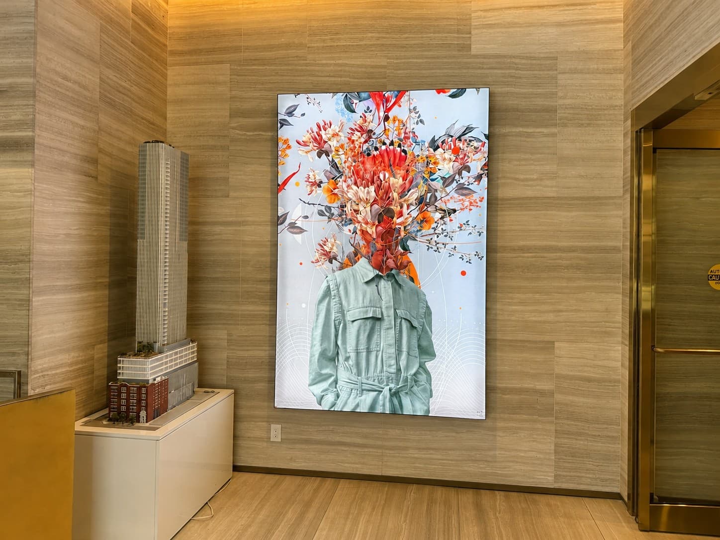 Wood-paneled lounge with a large floral artwork at Nester Finn Downtown Toronto